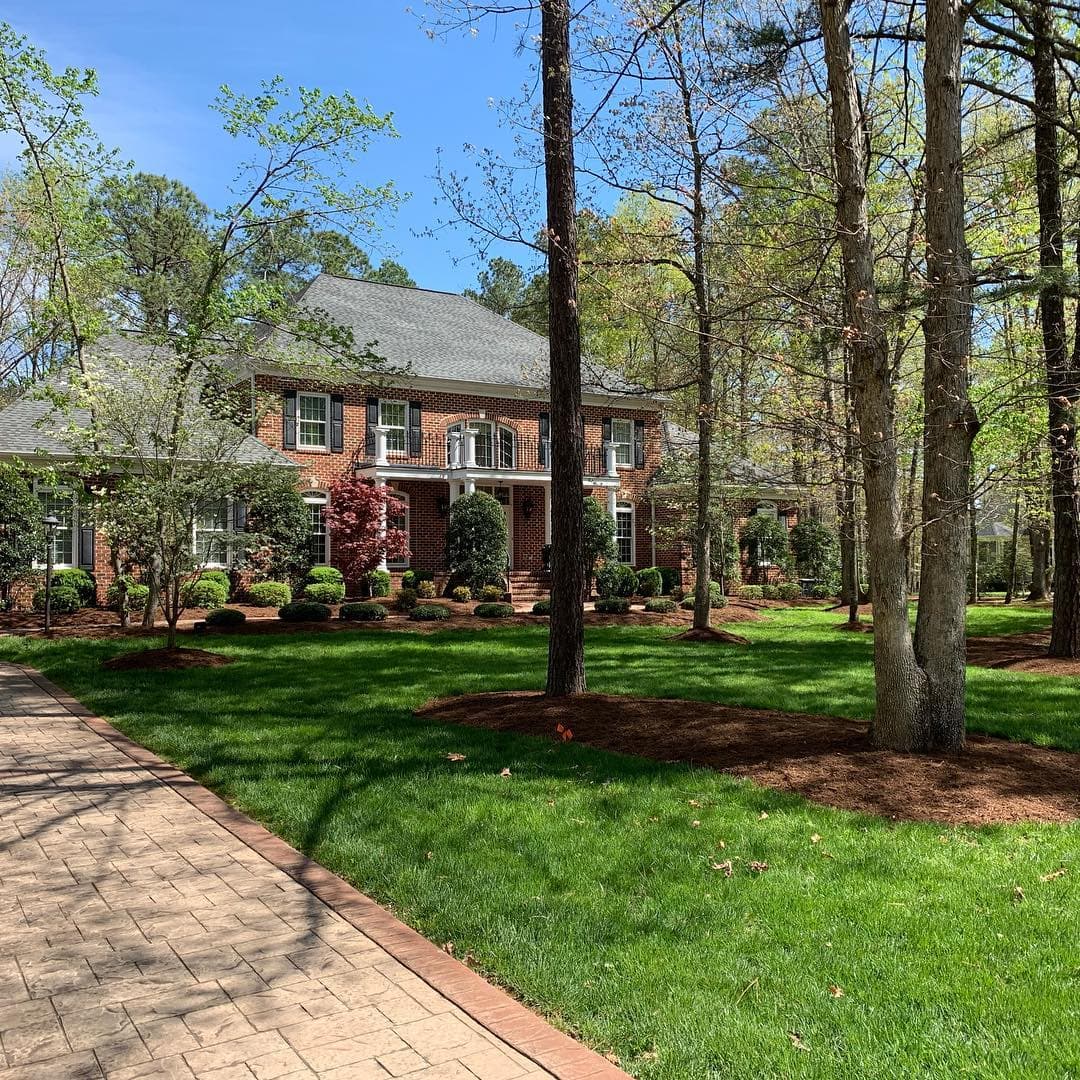 Completed residential project by ATS&L: smooth concrete walkway set into a freshly landscaped front yard
