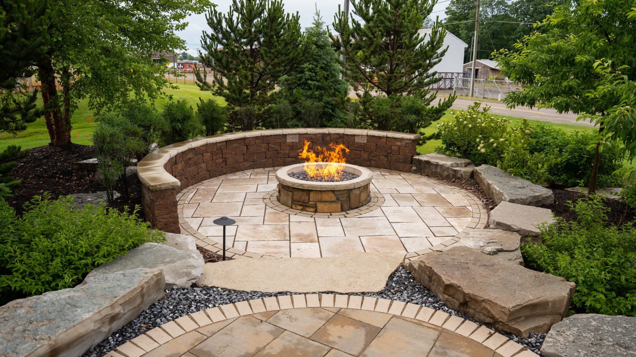 Wide view of a completed landscaping project with hardscape features